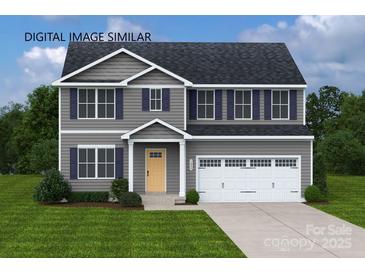 Charming two-story home with gray siding, blue shutters, covered entryway, and a two-car garage at 217 Basildon St # 1018, Lancaster, SC 29720
