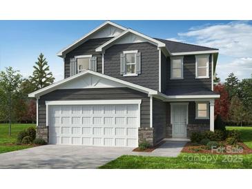 Charming two-story home featuring a two-car garage, gray siding, and a well-manicured lawn in a peaceful neighborhood at 522 Ramona St # 44, York, SC 29745
