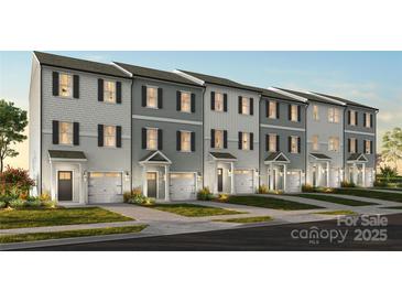Charming townhomes feature varied siding, private entrances, and attached one-car garages at 11716 Avocet Dr # 75, Charlotte, NC 28215