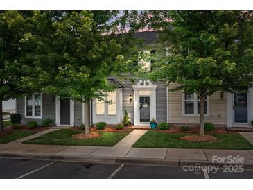 Charming townhome featuring well-manicured landscaping, a welcoming entrance, and inviting curb appeal at 2444 Mariners Cove Ln, Denver, NC 28037