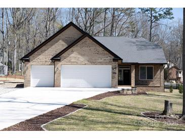 Charming single-story brick home with a two-car garage and a well-manicured front yard at 4531 Dry Run Rd, Fort Mill, SC 29708