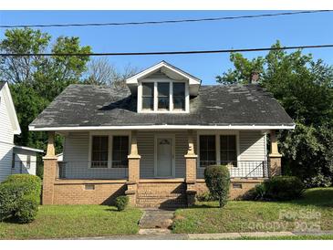 Charming single-Gathering home featuring a covered porch and neat front yard at 462 Dave Lyle Blvd, Rock Hill, SC 29730