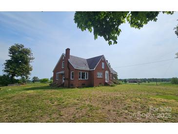 Charming, traditional brick home features a well-maintained lawn and classic architectural details at Tbd Jerusalem Church Rd, Marshville, NC 28103