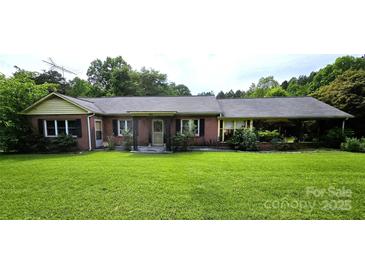 Charming brick home with a well-manicured front yard and mature landscaping at 1922 Salem Church Rd, Lincolnton, NC 28092