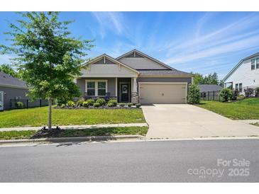 Inviting single-Gathering home with a well-manicured lawn, attached garage, and charming curb appeal at 3833 Isenhour Rd, Kannapolis, NC 28081