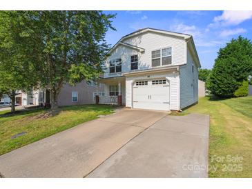 Charming two-story home with a two car garage, long driveway and a well-maintained lawn at 1457 Matthew Allen Cir, Kannapolis, NC 28081