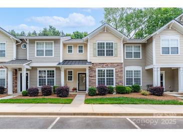 Charming townhome with stone accents, landscaped yard, and inviting entrance at 916 Coffee Tree Ln, Rock Hill, SC 29732