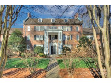 Stately brick building with a prominent entryway and manicured lawn at 101 S Laurel Ave # 72A, Charlotte, NC 28207