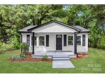 Charming home featuring white siding, black trim, and a welcoming front porch at 1155 Cedar Grove Ln, Rock Hill, SC 29732