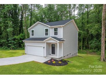 Charming two-story home with attached garage and landscaping at 1941 32Nd Ne St, Hickory, NC 28601