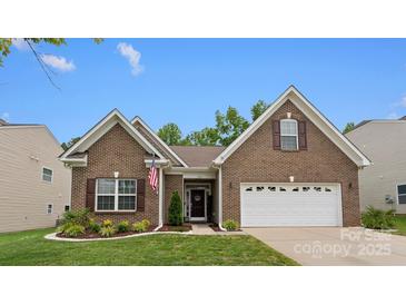 Charming brick home featuring an attached two-car garage and manicured lawn at 286 Mallard Head Dr, Rock Hill, SC 29732