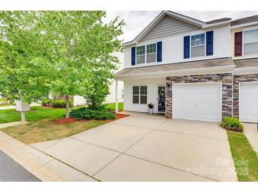 View of townhome with tidy landscaping, hardscaped driveway, and classic curb appeal at 2169 Shady Pond Dr, Clover, SC 29710