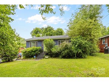 Charming single-story home with a well-maintained lawn, mature trees, and inviting curb appeal at 2536 Bancroft St, Charlotte, NC 28206