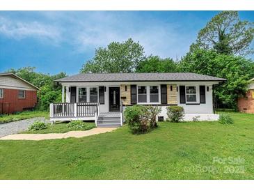 Charming single-story house with a well-manicured lawn and inviting front porch at 4914 Ridgeley Dr, Charlotte, NC 28208