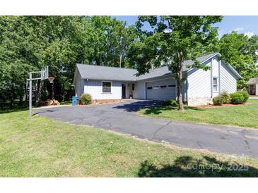 Charming single-story home featuring a well-maintained yard and a long paved driveway at 2011 20Th Street Ne Pl, Hickory, NC 28601