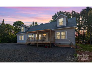 Charming home featuring a covered deck and beautiful sunset views at 1811 Continental Dr, Albemarle, NC 28001