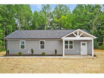 Charming single-story home featuring a gray exterior, simple landscaping, and a welcoming front porch at 195 Linda St, Salisbury, NC 28146