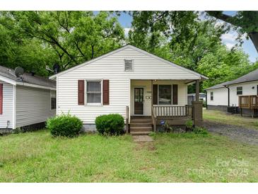 Charming single-story home featuring a cozy front porch and well-maintained landscaping at 730 Marble St, Charlotte, NC 28208