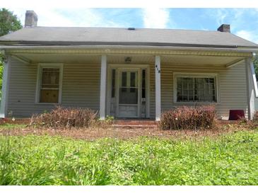 Charming single-story home with a covered front porch and a brick foundation at 418 W Cemetery St, Salisbury, NC 28144