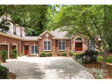 Charming brick home with well-manicured landscaping and a spacious driveway at 3504 High Ridge Rd, Charlotte, NC 29270