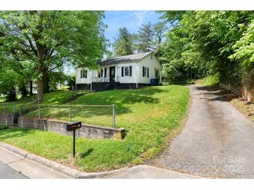 Charming single-story home with a well-maintained lawn and a quaint front porch at 1211 11Th Nw St, Hickory, NC 28601