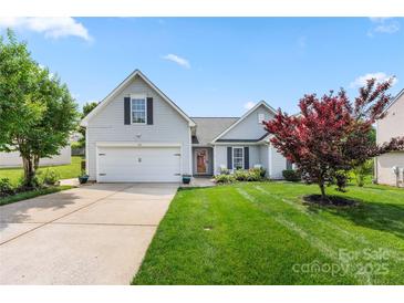 Beautiful home with a two-car garage, well-kept lawn, and mature landscaping in a suburban neighborhood at 114 Nevis Ln, Mooresville, NC 28115