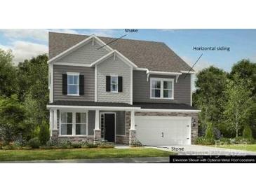Charming two-story home with shake and horizontal siding, complemented by stone accents on the facade at 108 Goorawing Ln, Mooresville, NC 28115