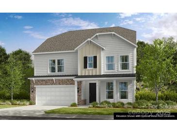 Charming two-story home with stone accents, white siding, neutral trim, and a spacious front yard at 1431 Hubert Graham Way, Tega Cay, SC 29708