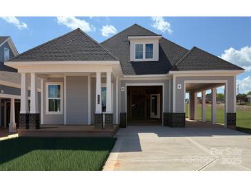 Charming craftsman-style home with gray siding, brick accents, and a covered front porch at 4419 Splash Trl # 158, Sherrills Ford, NC 28673