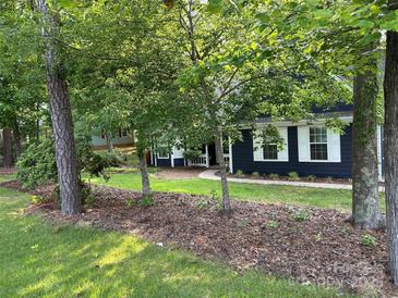 Charming home featuring a navy exterior, white trim, and lush landscaping at 172 Valleybrook Dr # 8, Denver, NC 28037