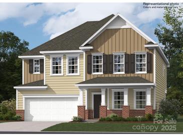 Two-story home featuring a covered porch with classic columns and a two-car garage at 4404 Dusty Orchard Rd, Kannapolis, NC 28081