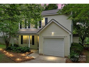 Charming two-story home featuring a garage and a well-manicured front yard at 1410 Swaying Branch Ln, Clover, SC 29710