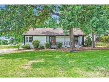 Charming single-story home with a well-maintained lawn, complemented by mature trees for shade at 2009 Pinevalley Rd, Rock Hill, SC 29732