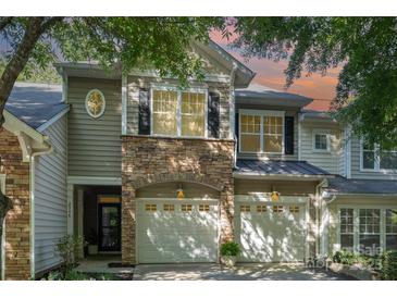 Charming townhome with stone accents, attached two car garage, and neutral siding at 2548 Chasewater Dr, Fort Mill, SC 29707