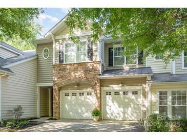 Charming townhome featuring a stone facade and two-car garage for convenient parking at 2548 Chasewater Dr, Indian Land, SC 29707