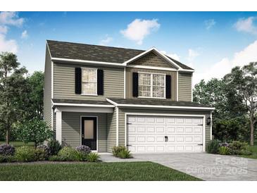 Charming two-story home featuring a covered porch, two-car garage, and classic architectural details at 1508 Doran Ter, Richburg, SC 29729