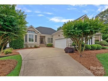 Charming home featuring a well-maintained lawn and a welcoming driveway at 17308 Players Ridge Dr, Cornelius, NC 28031