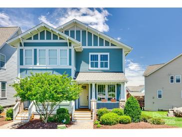 Charming blue two-story home with landscaped front yard and a welcoming porch at 750 Waterscape Ct, Rock Hill, SC 29730