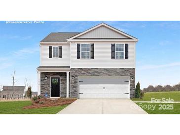 Two-story home with stone accents, a two-car garage, and a welcoming front porch at 925 Two Brothers Ln, York, SC 29745