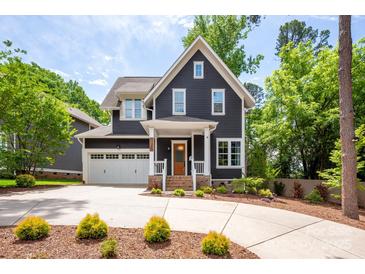 Charming two-story home with manicured landscaping and a two-car garage at 1620 Arnold Dr, Charlotte, NC 28205
