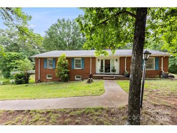 Charming brick home with a well-maintained lawn and inviting front entrance at 16453 Nc Hwy 73 Hwy, Albemarle, NC 28001