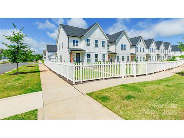 Charming townhomes with white picket fences, beautiful lawns, and impeccable landscaping at 651 Melville Dr, Rock Hill, SC 29732