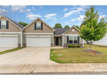 Charming single-story home featuring a one car garage, well-manicured lawn and lovely curb appeal at 1405 Amberlight Cir, Salisbury, NC 28144