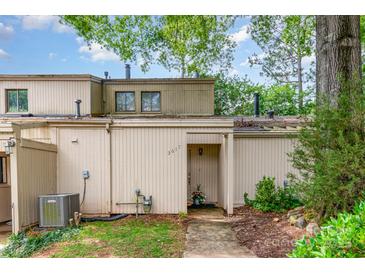 Inviting two-story townhome featuring neutral siding, a covered entryway, and mature trees enhancing curb appeal at 3617 Willow Point Dr, Charlotte, NC 28277