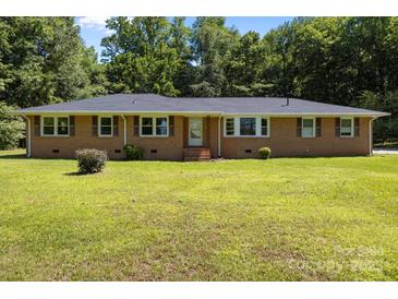 Charming one-story brick house with a well-manicured lawn and mature trees at 1810 Country Manor Ln # 34, Rock Hill, SC 29730