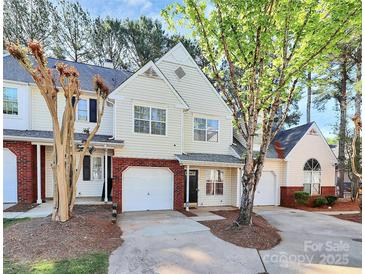 Charming townhome with a well-maintained lawn and attached garage in a desirable neighborhood at 5953 Prescott Ct # 3105, Charlotte, NC 28269