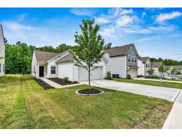 Charming home with a well-manicured lawn, white siding, and a welcoming front entrance at 139 Batten Ridge Dr, Statesville, NC 28677