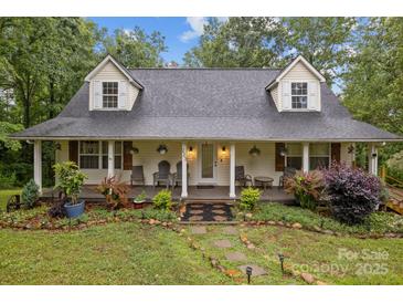 Charming home with a welcoming front porch and beautifully landscaped front yard at 223 Tennessee Trl, Lincolnton, NC 28092