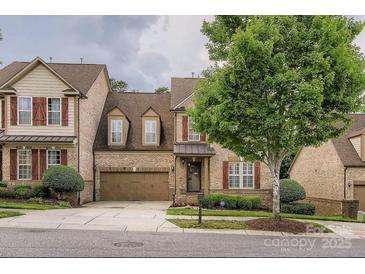 Charming brick home with an attached garage, landscaped yard, and a welcoming entrance at 2234 Donnington Nw Ln, Concord, NC 28027