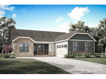 Charming one-story home showcasing stone accents, gray siding, a paved driveway, and a well-maintained front lawn at 1644 Dresden St, Rock Hill, SC 29732